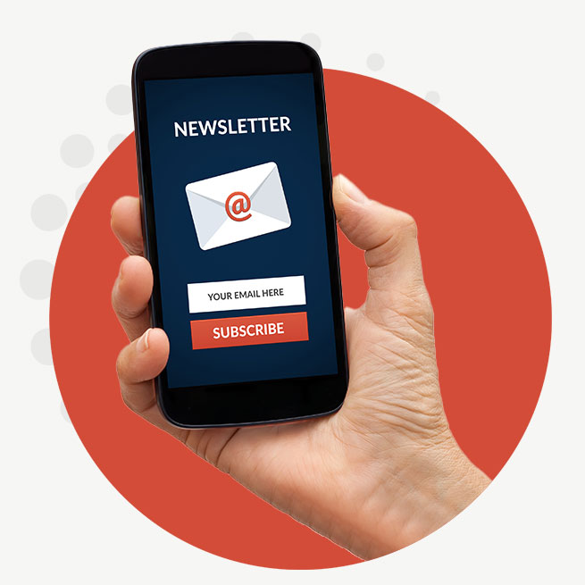 A closeup of a hand in an orange circle holding a cell phone with a form to signup for a newsletter